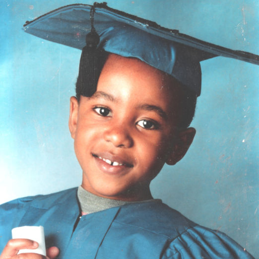 a profile picture of me smiling at nursery school graduation.